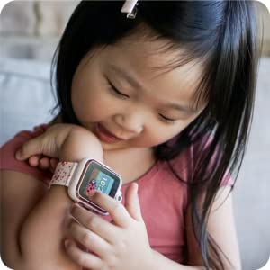 Photo of little girl playing with PlayZoom watch. 