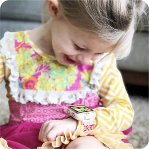 Photo of little kid smiling and laughing while looking down at PlayZoom watch.